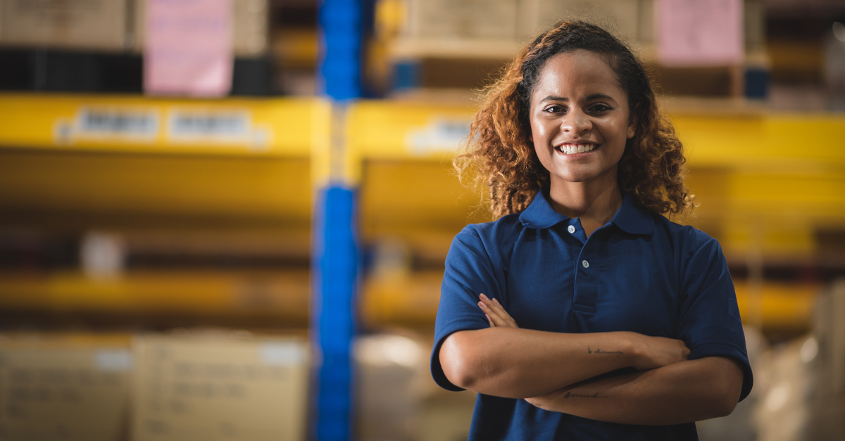 diverse woman smiling in warehouse