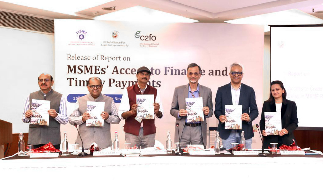 Six people holding the Delayed Payments 3.0 Report at an event for MSMEs India’s Access to Finance and Timely Payments.