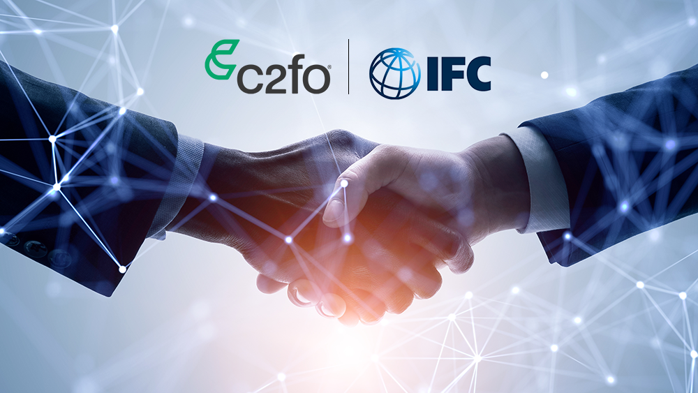 Two people shaking hands with C2FO and IFC logos above, surrounded by connected digital network lines.